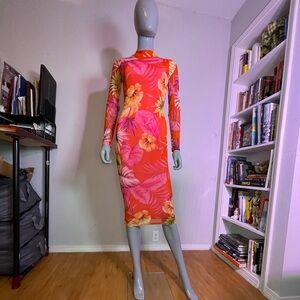 Vibrant,long sleeve maxi dress. Polyester/spandex. Form fitting, good stretch.